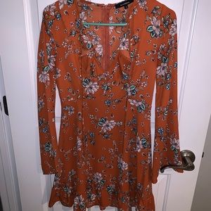 Orange floral dress with ruffle v-neck